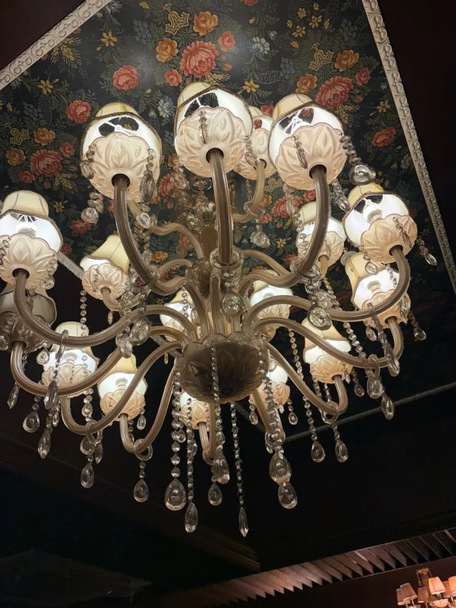Large chandelier hanging close to the seats