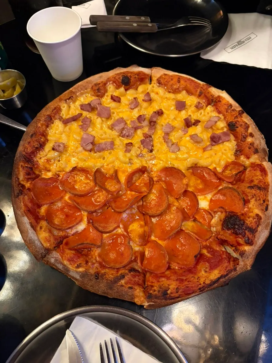 Pizza and drinks set on the table