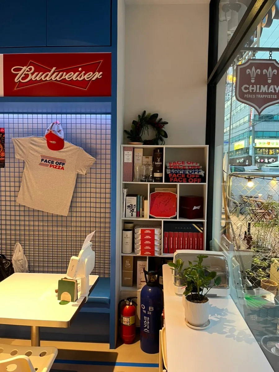 Self-serve bar with water, pickles, and hot sauce