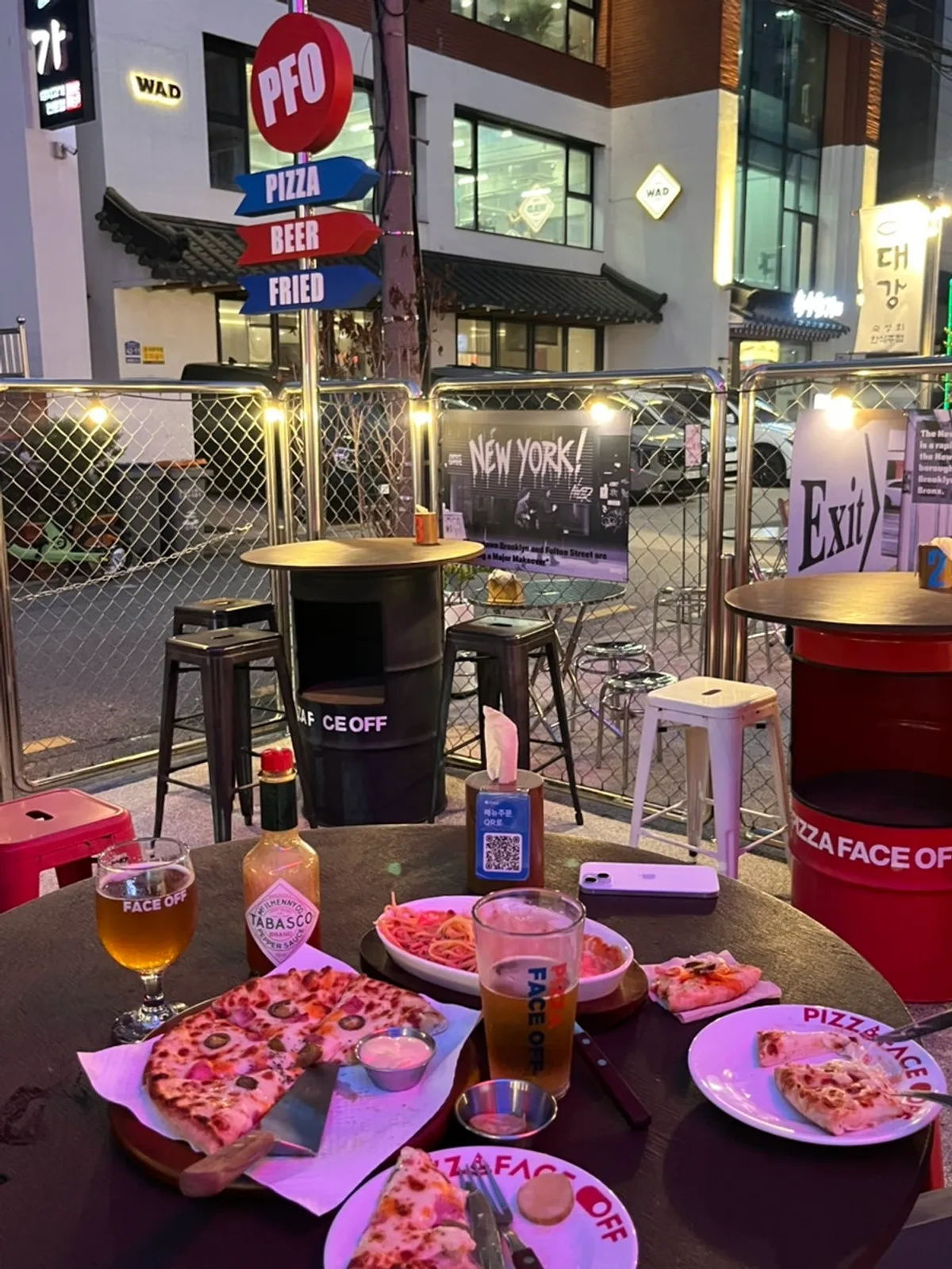 Rosé pasta with sauce mixed into the noodles, on the outdoor table