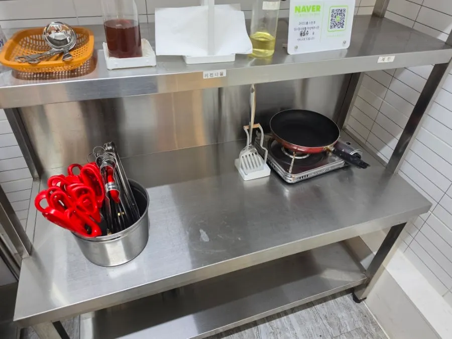 Self-serve display case holding pork belly and chicken neck