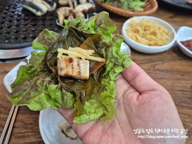 A piece of eel dipped in sauce