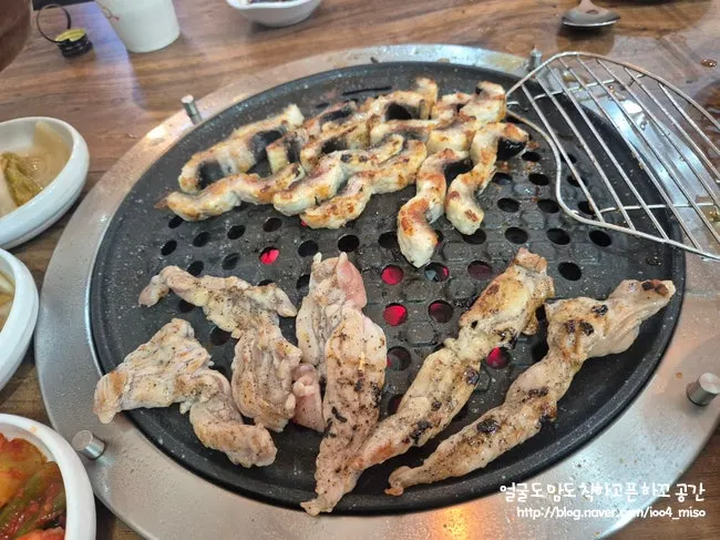 Chicken neck meat cooking on the grill