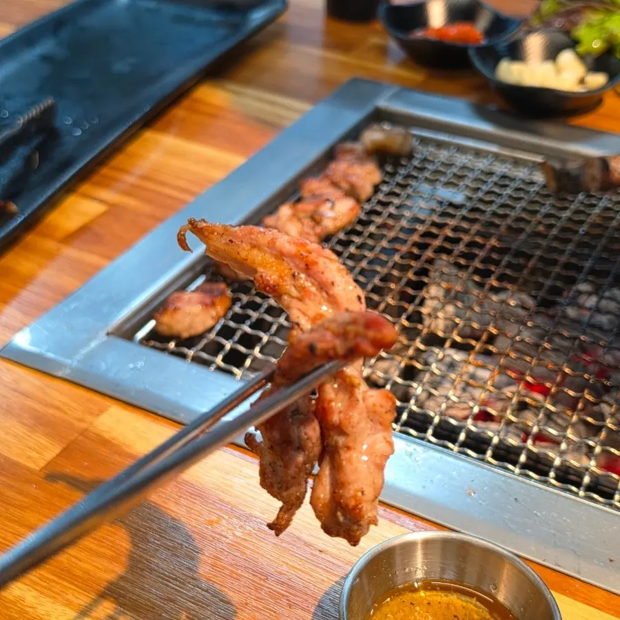 Thick raw pork belly on the grill