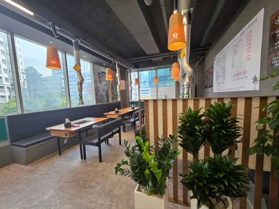 Group dinner hall seating with charcoal grill tables