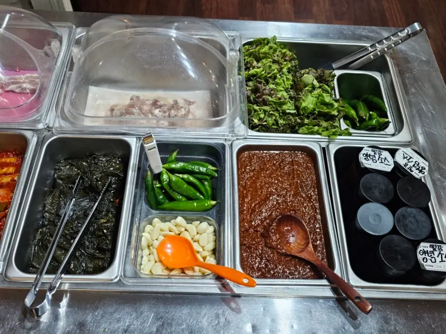 Side dishes and lettuce for wraps at the self-bar