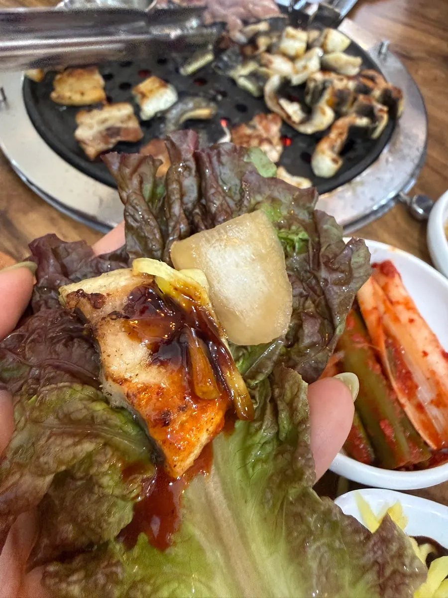 Eel and pork belly grilling together