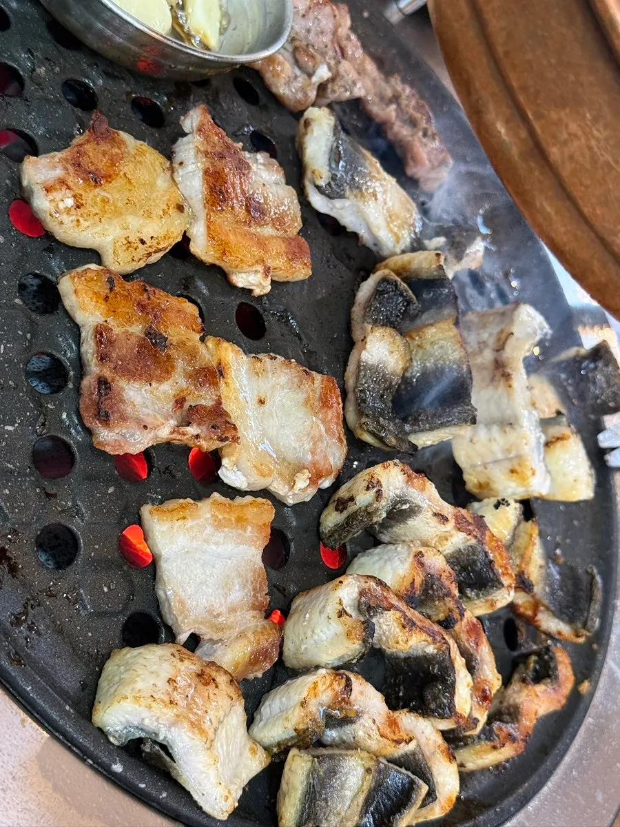 Grill piled high with grilled eel