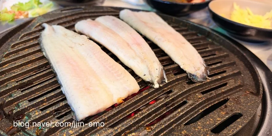 Refilled eel being grilled