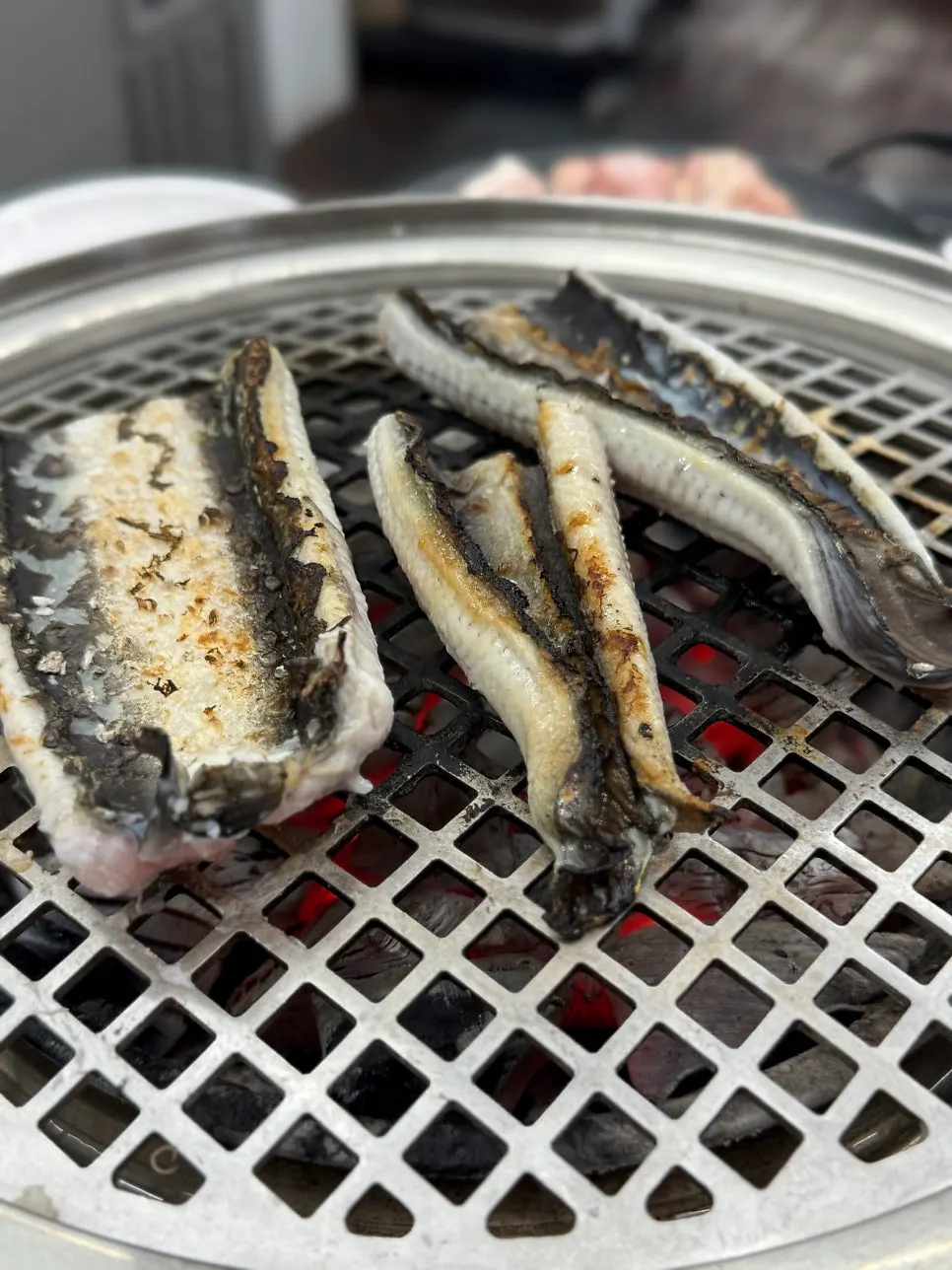 Freshwater eel grilling skin side down