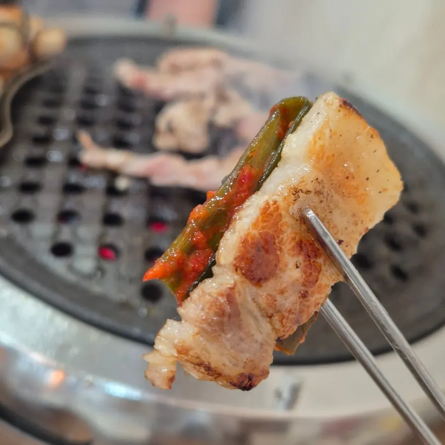 Pork belly topped with green onion kimchi