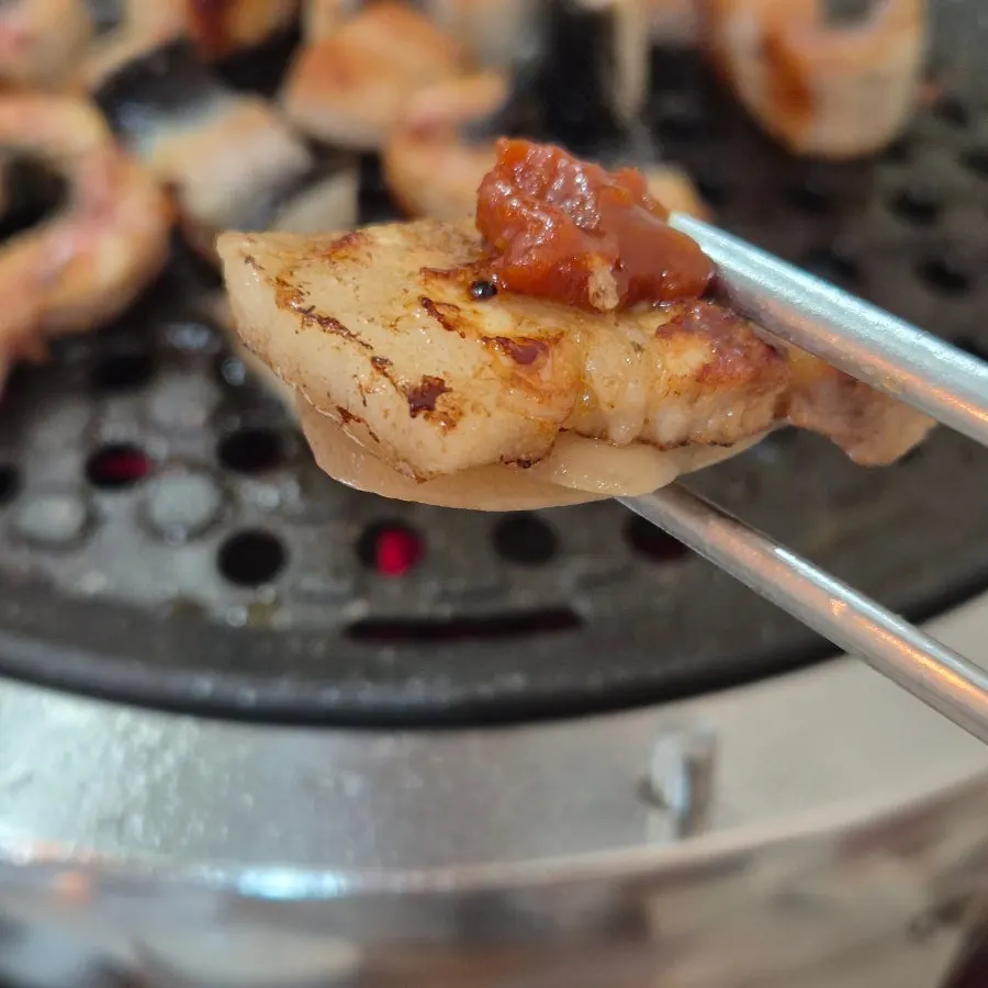 Pork belly and eel together on the charcoal grill