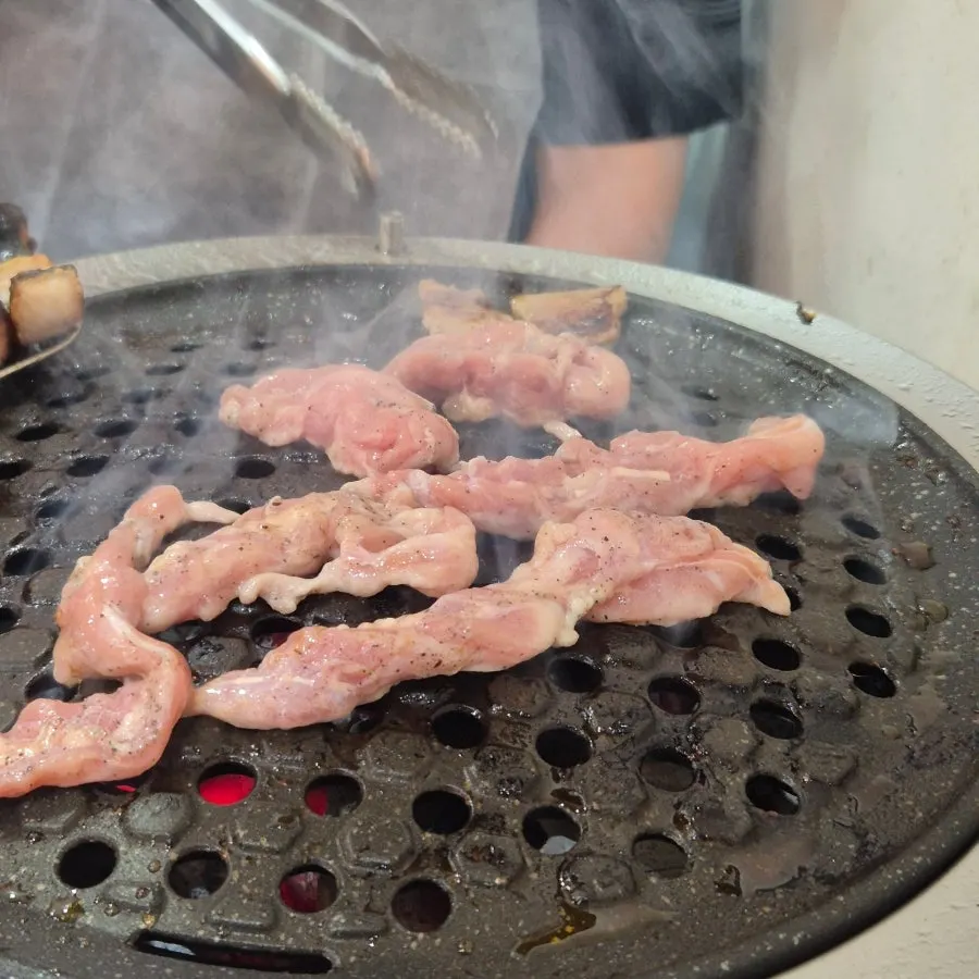 Seasoned domestic duck being grilled