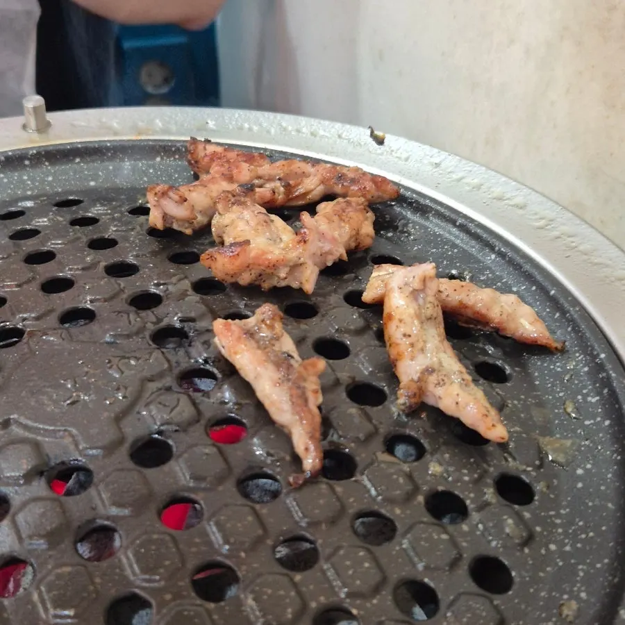 Duck picking up a smoky flavor over charcoal