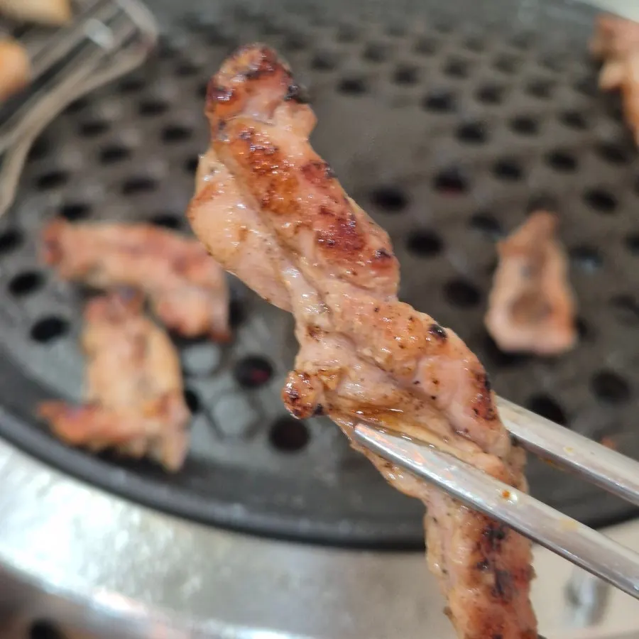 Duck dipped into eel sauce