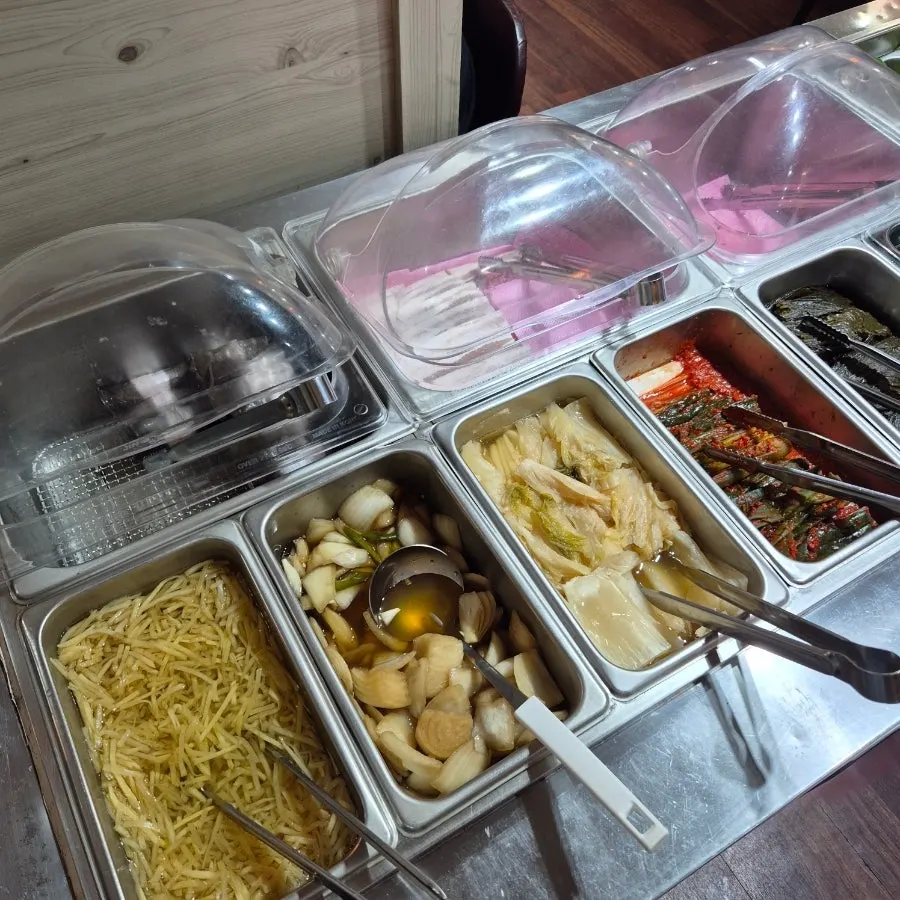 Self-serve corner with small plates and sauces