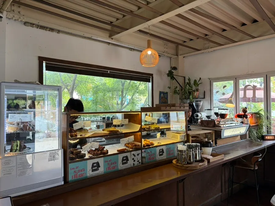 Café space with a main building and outdoor terrace