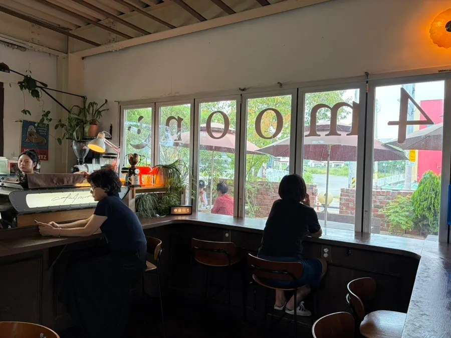 Café space with a main building and outdoor terrace