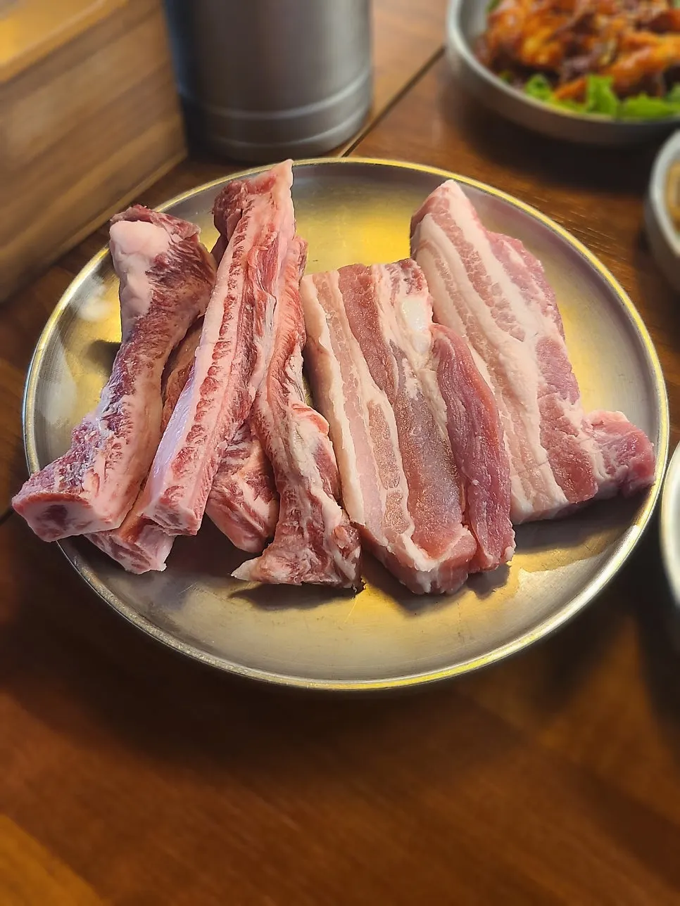 Menu board describing charcoal fresh pork belly