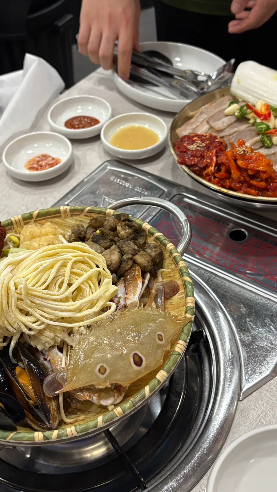 Fresh seafood topping the kalguksu