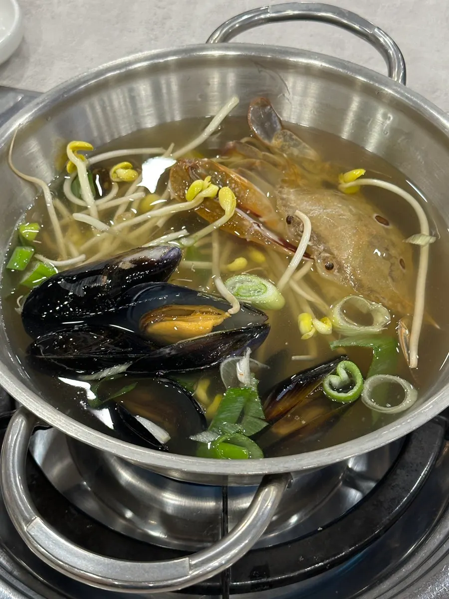Seafood boiling in the pot for seafood kalguksu