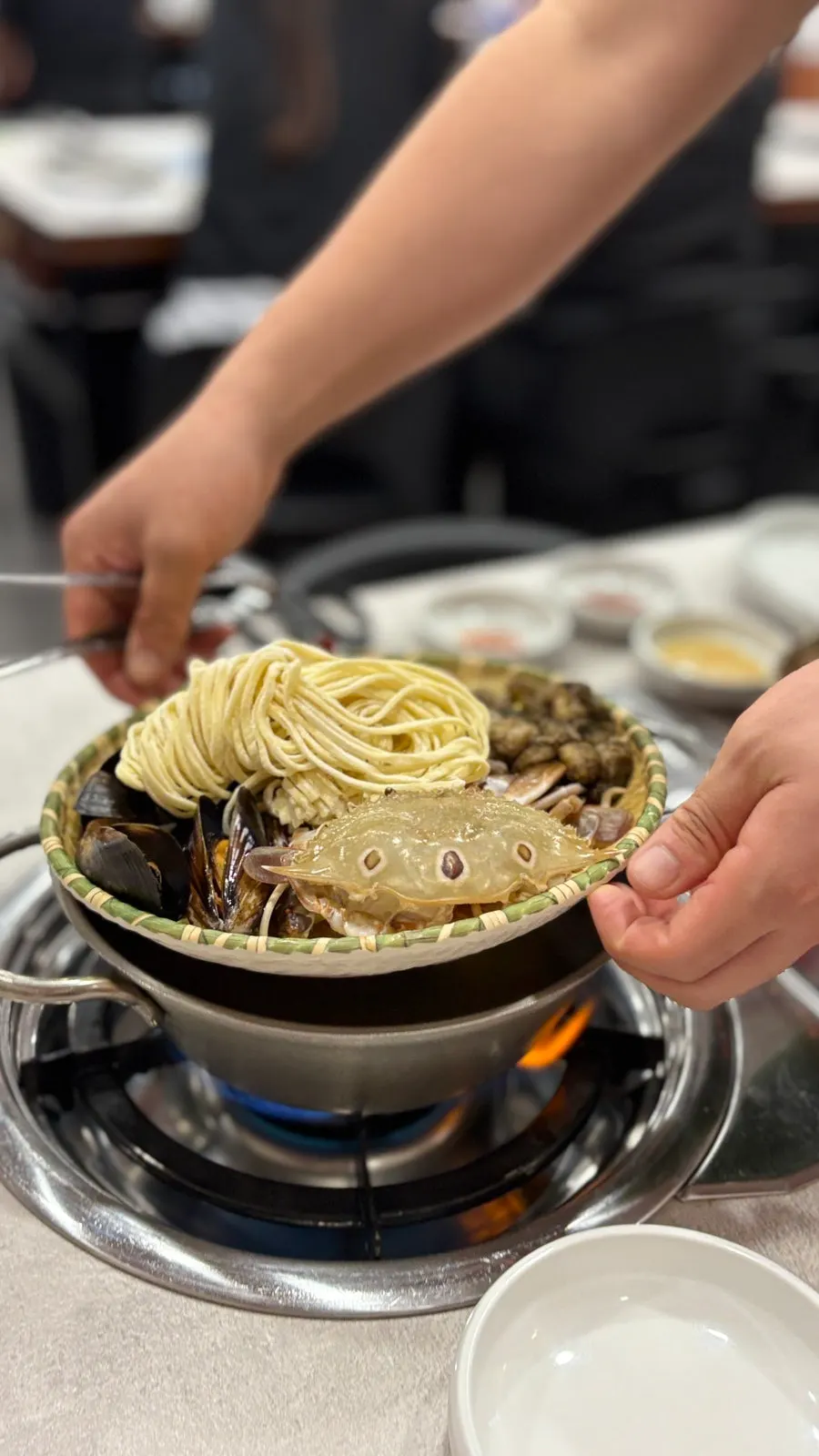 Table with bossam and the kalguksu pot