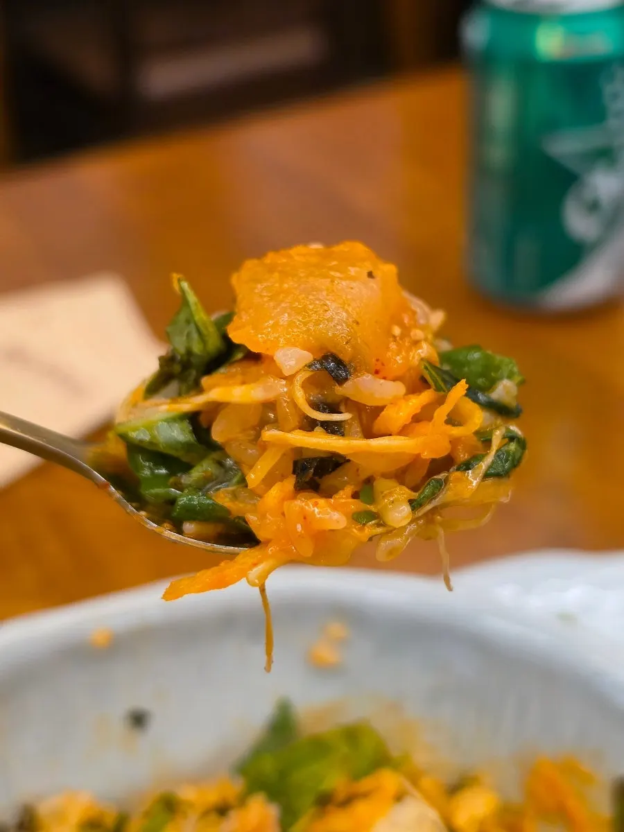 A spoonful of the sashimi bowl with sesame oil aroma