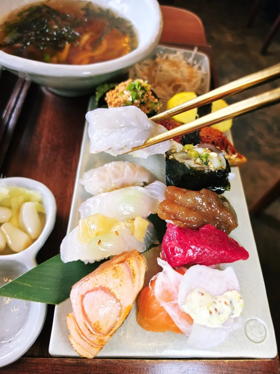 Sushi topped with a special house sauce