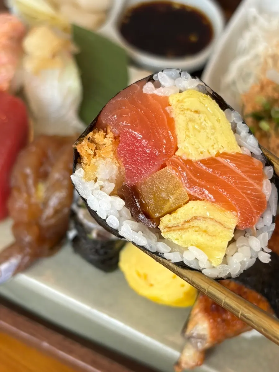 A piece of futomaki topped with anago liver