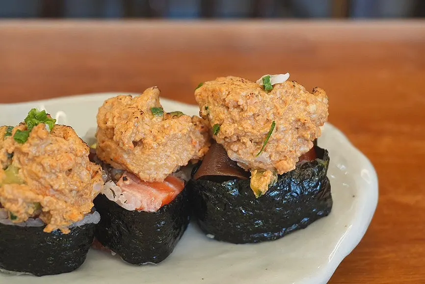 A plate of Sonsi Ankimo Futomaki topped with ankimo