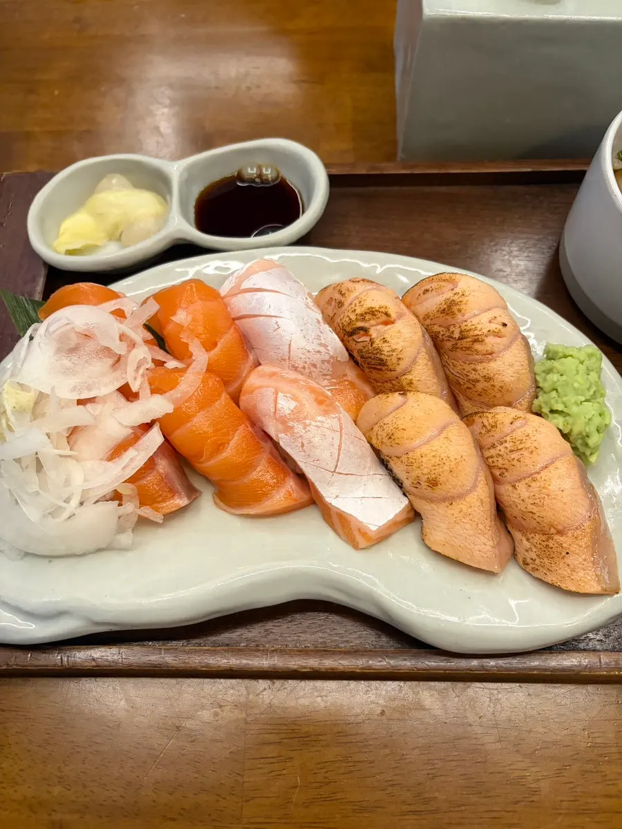 A plate of 10pc thick salmon nigiri