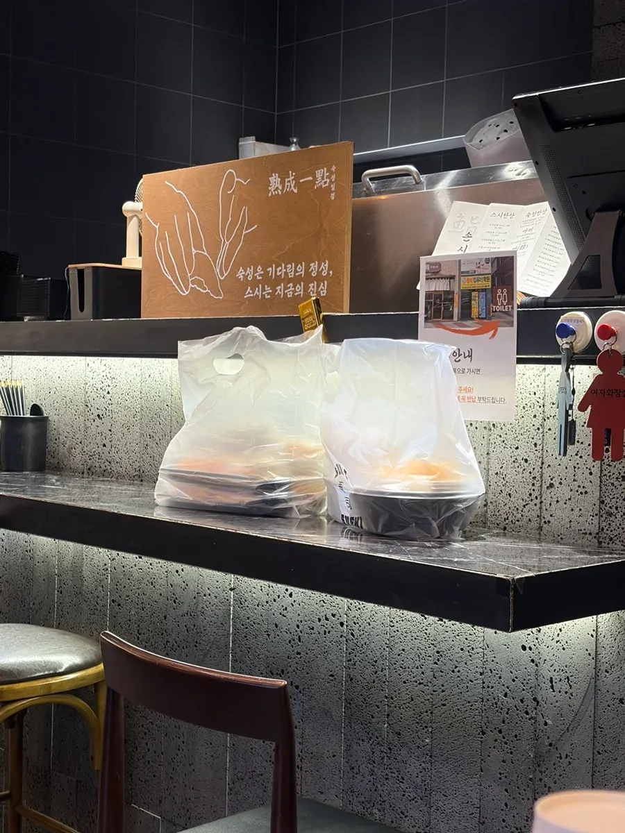 Storefront counter with takeout order signage