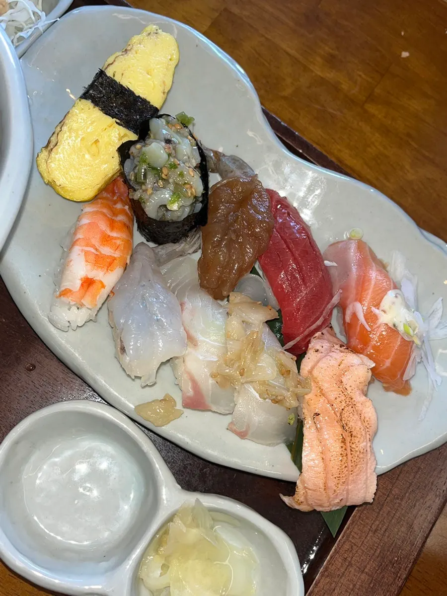Sushi with thick slices of sashimi on top