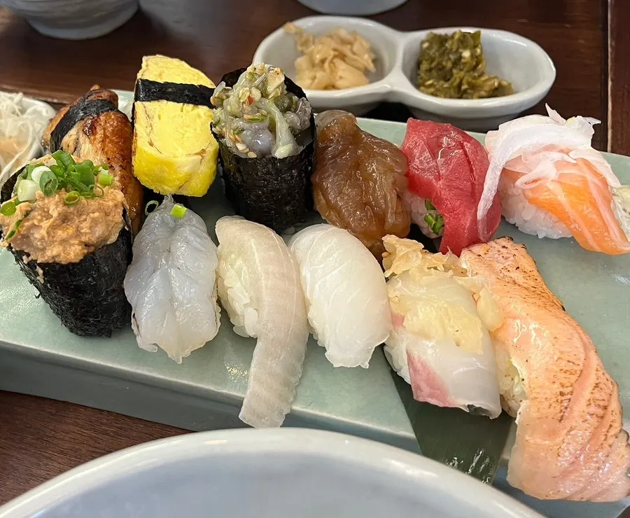 12 pieces of sushi arranged on one plate