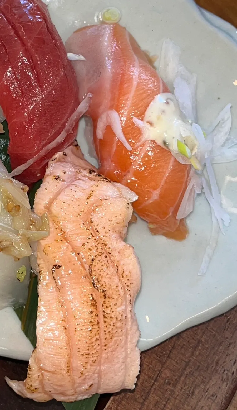 Picking up a piece of aged flounder sushi