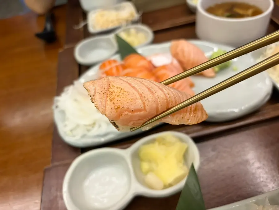 Two pieces of torched salmon nigiri