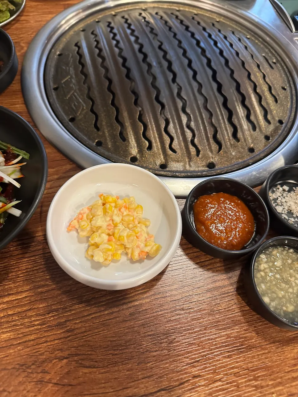 Various sauces served alongside the meat