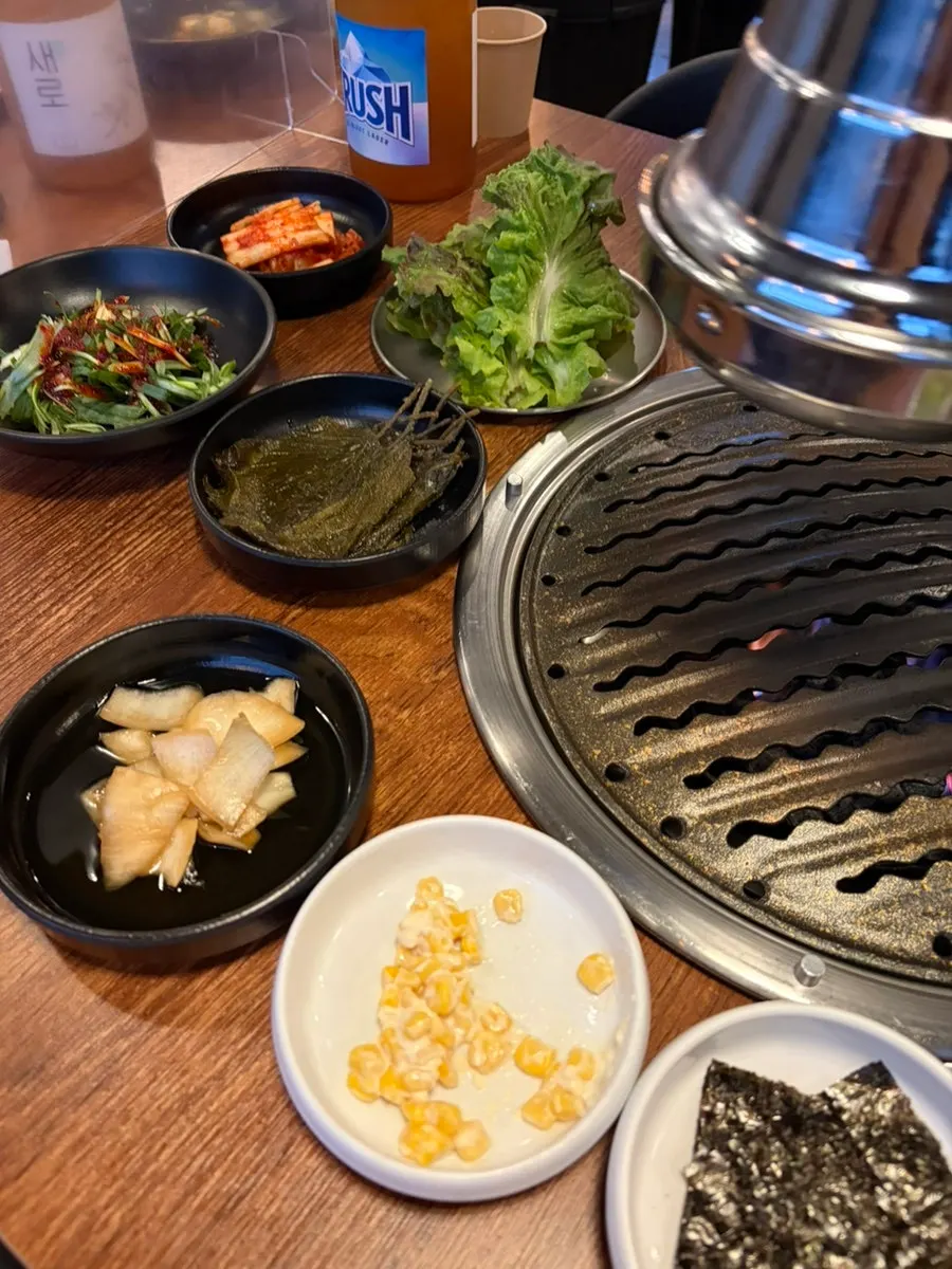 Basic side dishes at Muttuk Sookdae Main Branch, including scallion salad and pickles