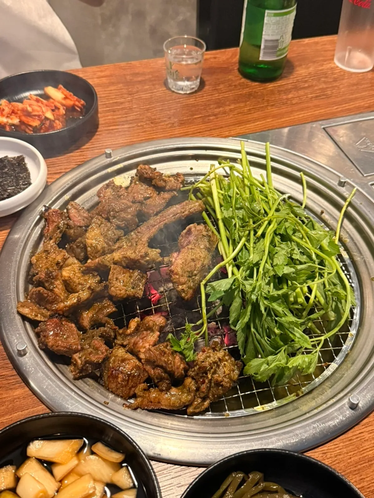 Matcha ribs grilling over charcoal