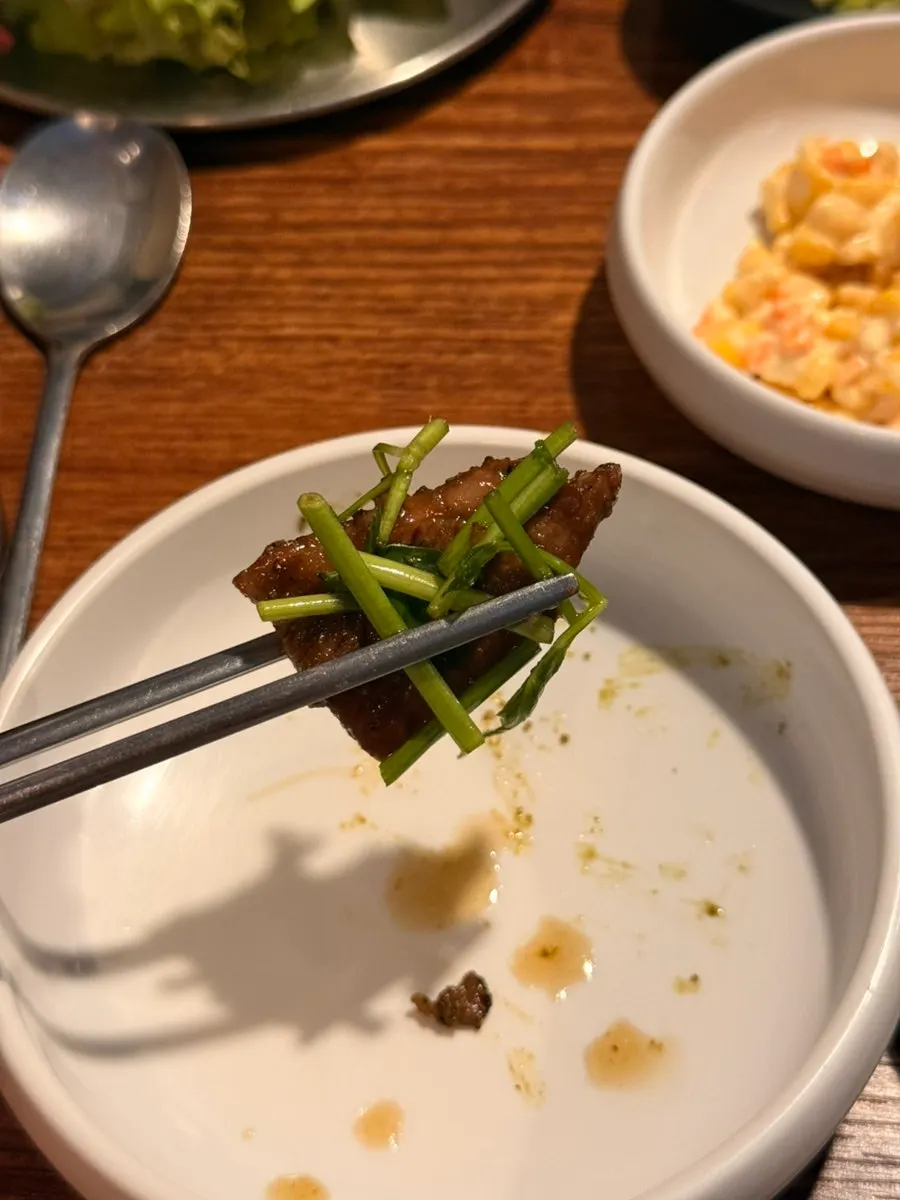 Golden-brown grilled matcha ribs with minari