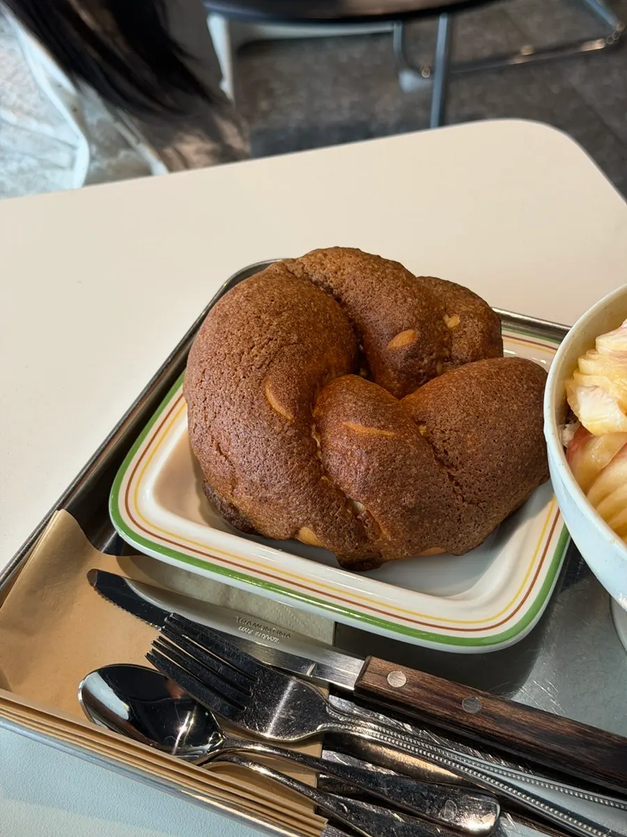 Inside of the mocha bagel torn open by hand