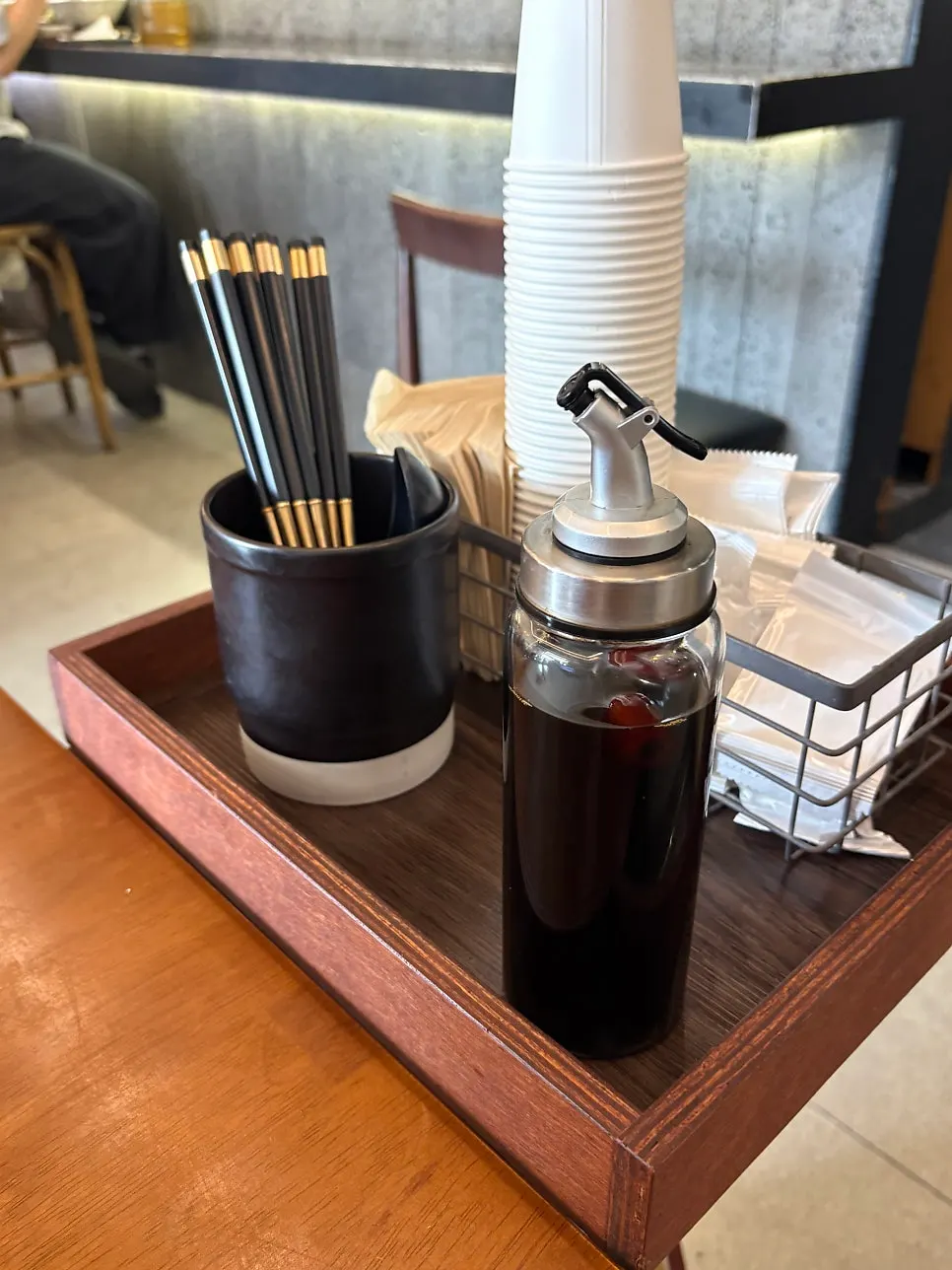 Tissues, wet wipes, and chopsticks set out beside the table