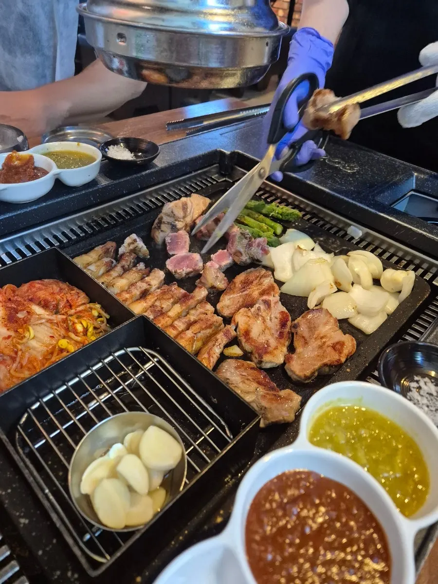 Staff grilling the meat