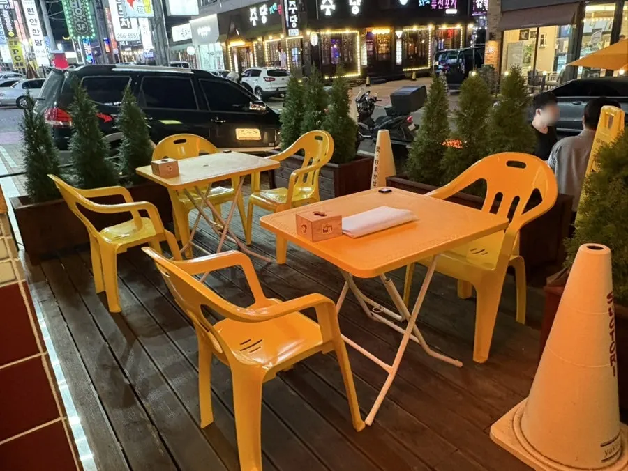 Window patio seats at Sutori with the doors wide open