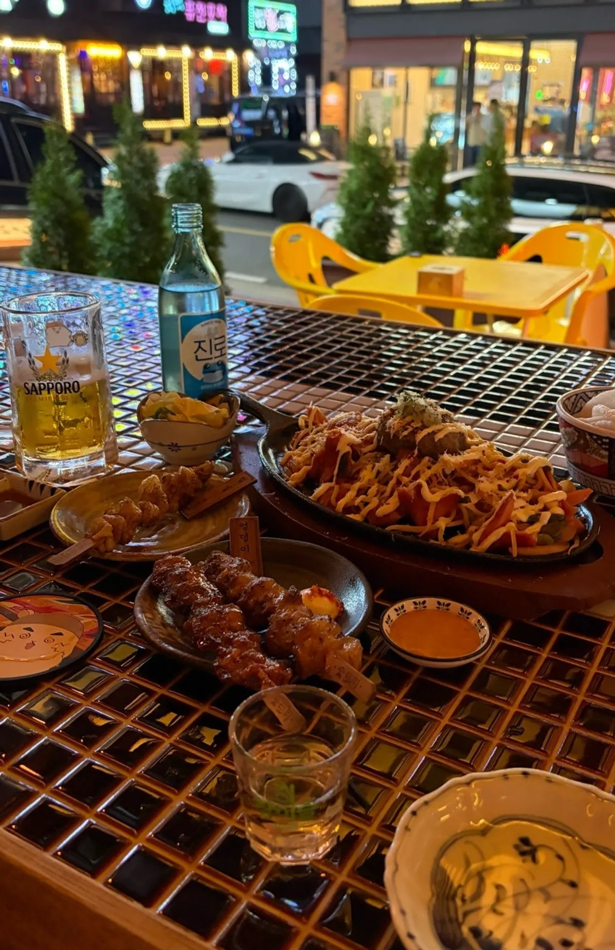 A spread of Sutori's yakitori skewers with draft beer