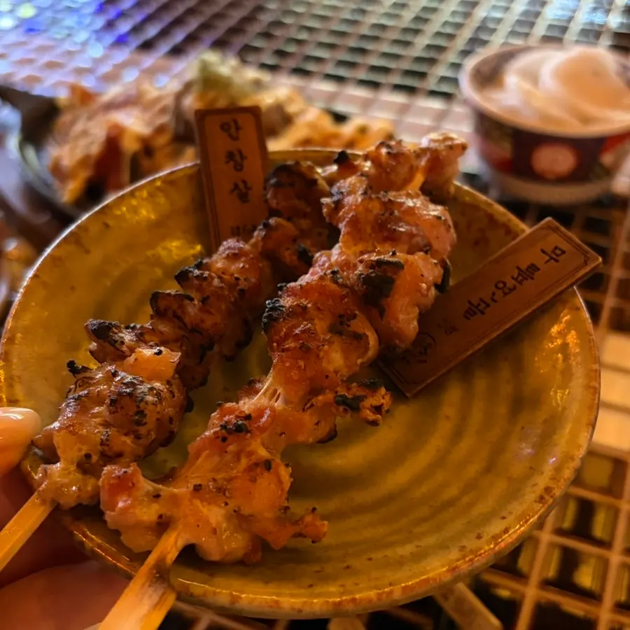 Yakitori skewer dipped into mayonnaise