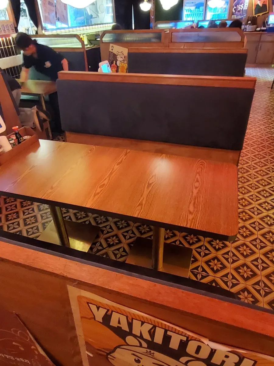 Dimly lit seating area with a Japanese izakaya atmosphere