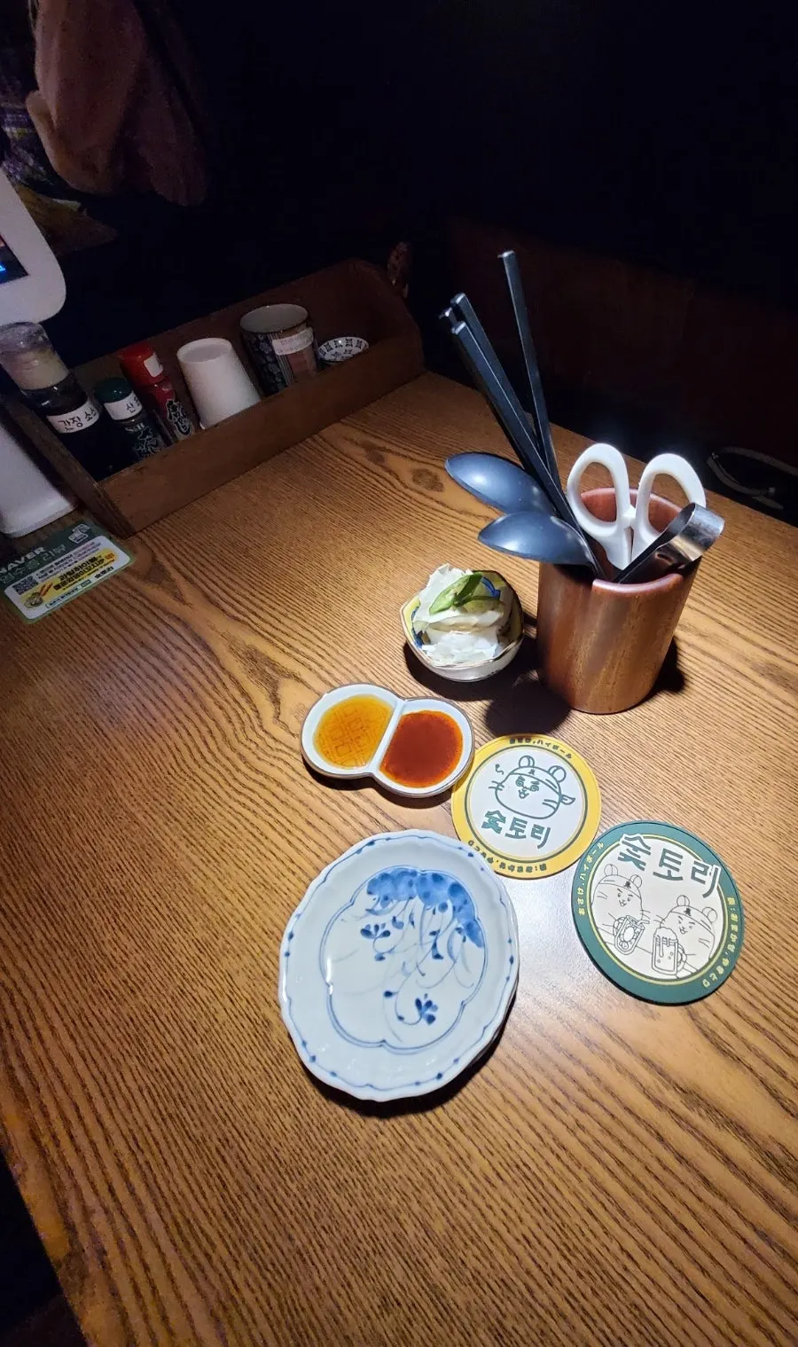 A cute bottle opener on the table at Soottori
