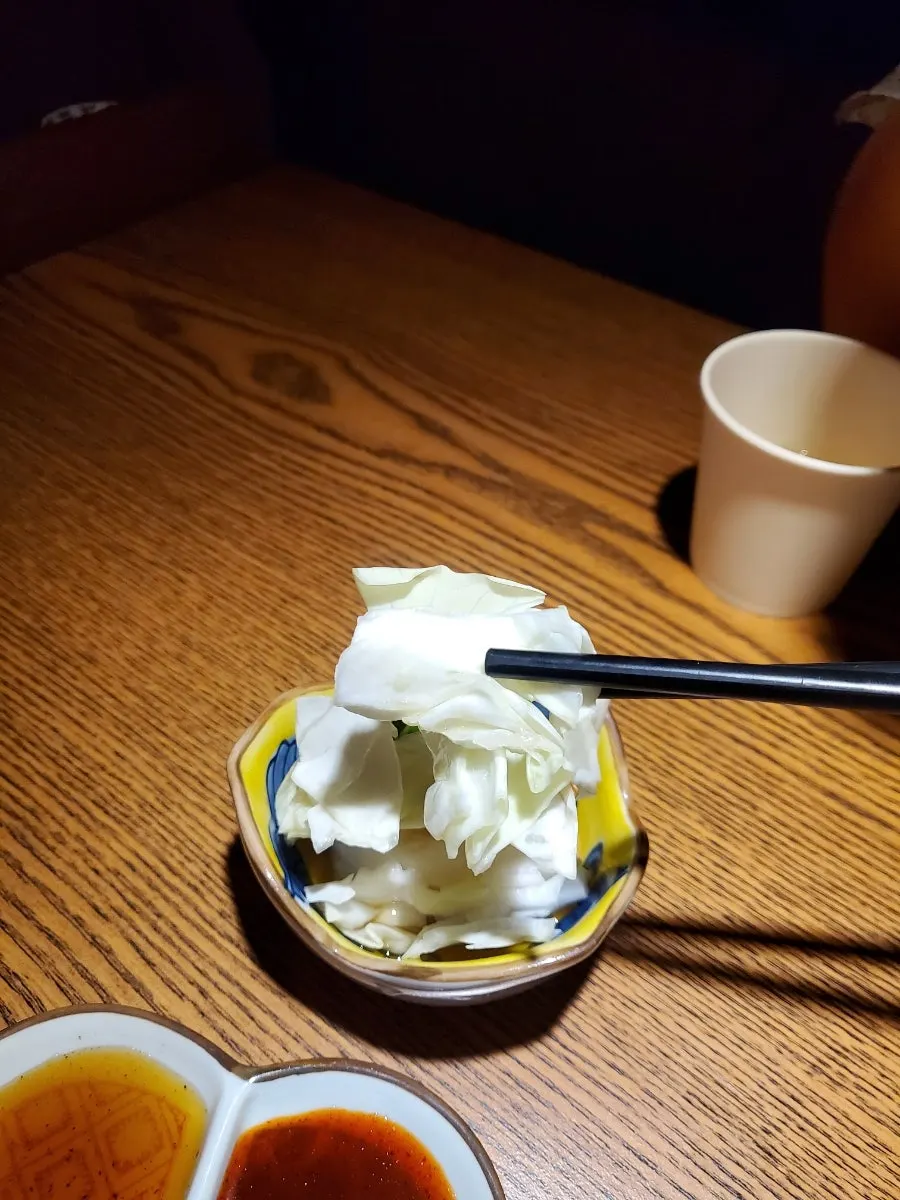 A plate of cabbage and sauce served as the basic side dish