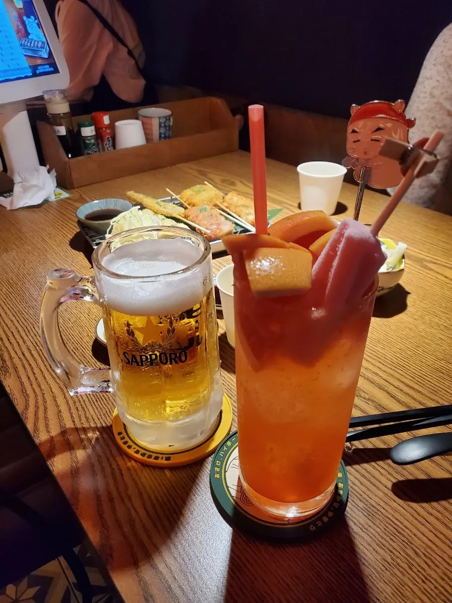 Grapefruit highball with a mini Screwbar popsicle and a draft beer